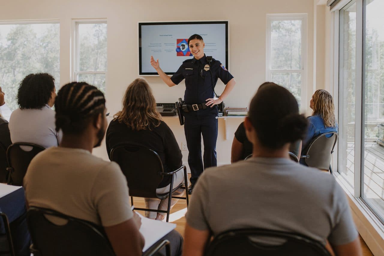 A police officer leading a driver-safety class
