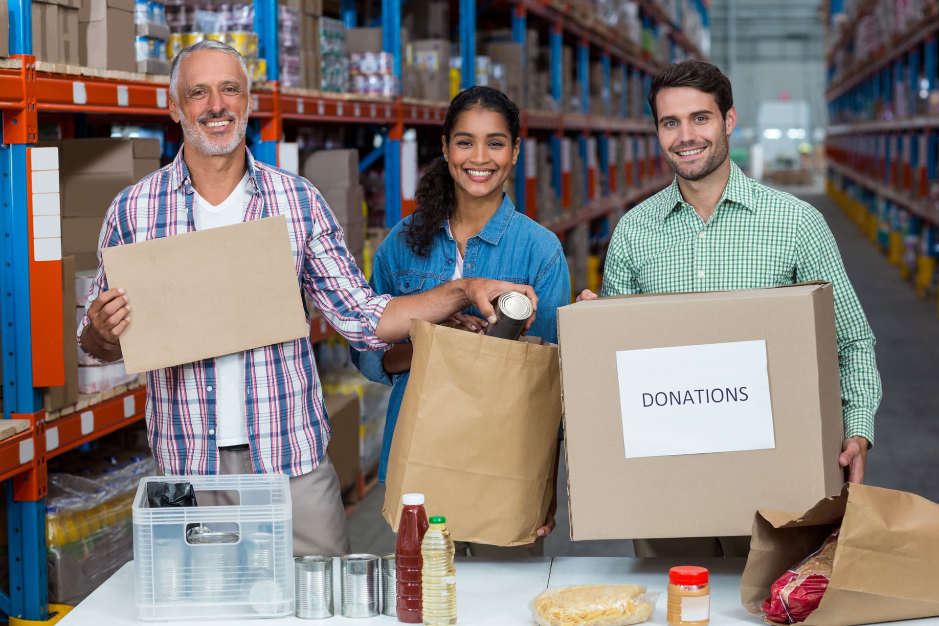 Partners packing food boxes together