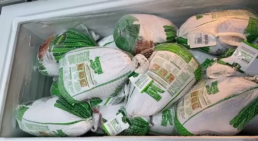 A freezer full of whole turkeys ready for families